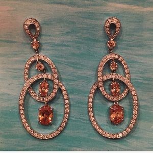 Silver earrings with amber crystals.